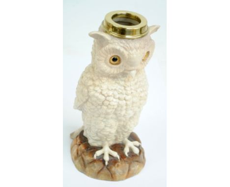 A German Sitzendorf porcelain lamp base modelled as a seated owl with glass inset eyes, marked to base, height 24.5cm, with l