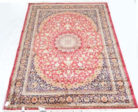 A red ground Keshan carpet, 280 x 200cm.