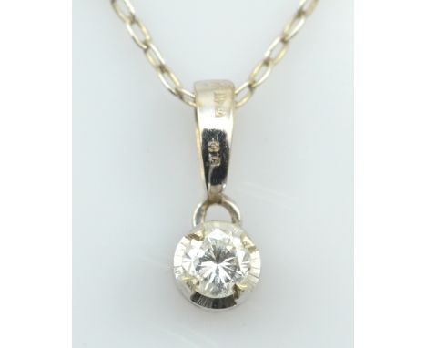 An 18ct white gold and diamond pendant, the single round cut stone approx 0.2cts in claw setting, suspended on a silver open 