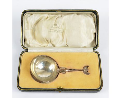 BROOK & SON; a George V hallmarked silver sauce ladle with circular bowl and handle modelled as a stylised dolphin, Edinburgh