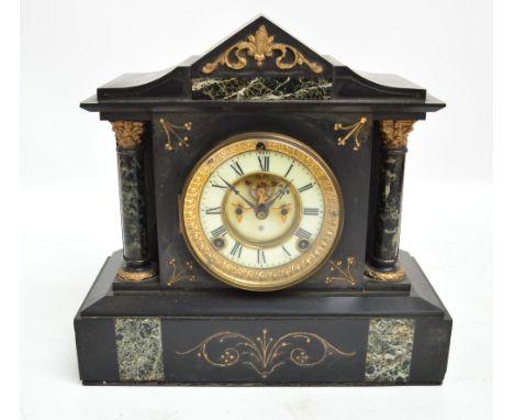 A late 19th century American Ansonia black slate mantel clock with gilt heightened decoration and marble set in pediment, pli