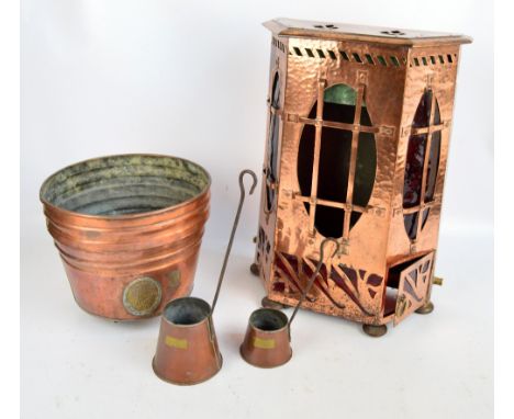 An Arts and Crafts copper stove converted into a lamp with red tinted glass panels, height 59cm also a circular tapering copp