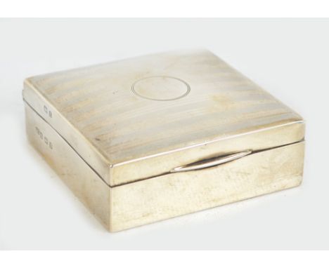 GEORGE UNITE; a George V hallmarked silver square section cigarette case, centred with a circular vacant cartouche to the hin