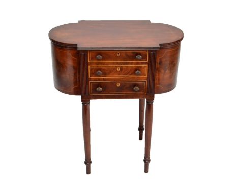 An early 19th century mahogany work table, the hinged lid enclosing bow fronted lidded side compartments and pull-out central