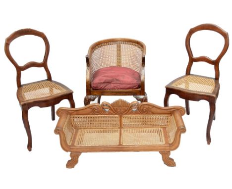 An early 20th century bergère caned tub chair, a pair of cane seated bedroom chairs and a child's bergère caned sofa (4).