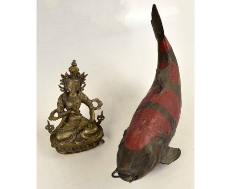 A Chinese figure of a carp with incised scales, length 47cm and a Sino-Tibetan cast metal figure of a seated deity, height 20