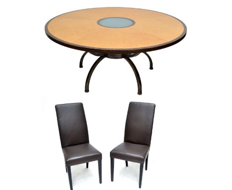 A large reproduction bird's eye maple veneered and crossbanded circular dining table with glass central panel and metalwork f