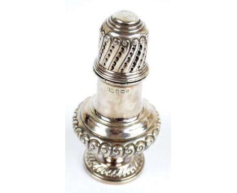 LEE & WIGFULL; a Victorian hallmarked silver baluster footed sugar caster with wrythen twist gadrooned decoration to the base