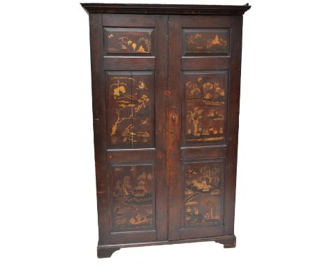 A 19th century oak and later chinoiserie gilt decorated wardrobe, the moulded cornice above twin panelled doors with shelves,