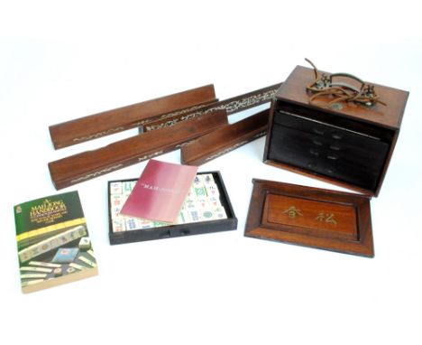 A boxed Mahjong set with five drawers, a set of four wooden and bone inlaid tile stands, with manual (6).