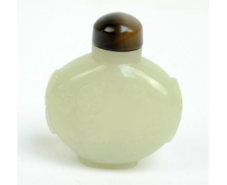 A Chinese pale jade flat oval snuff bottle, carved and scratched with a figure of a man pulling a rickshaw and with twin mask