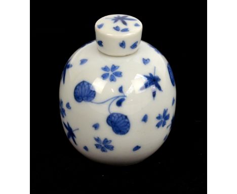 A late 19th/early 20th century Chinese porcelain tea caddy of globular form, painted in underglaze blue with foliate sprays, 