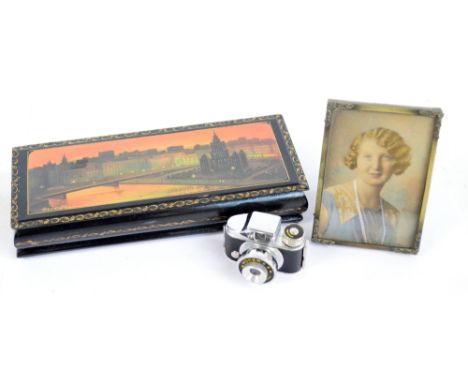 A miniature cased Homer camera, a Russian lacquered rectangular box with printed decoration and a small printed miniature (3)