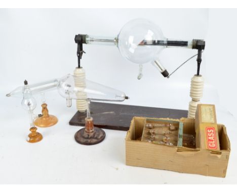 A Griffin & Tatlock large x-ray tube with porcelain insulators and pine rectangular plinth, a Maltese cross tube on original 