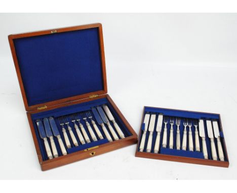 HARRISON BROTHERS & HOWSON; a Victorian hallmarked silver collared and finialed boxed set of 12 fruit knives and forks, with 