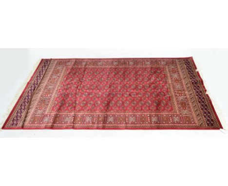 A red ground Bokhara carpet, 230 x 160cm.
