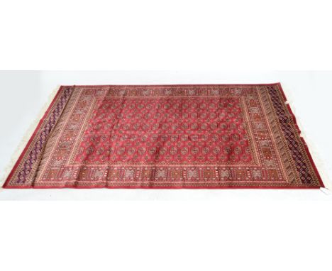 A red ground Bokhara carpet, 230 x 160cm.