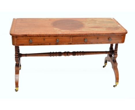 An early 19th century rosewood and satinwood crossbanded sofa table, the rounded rectangular top with two frieze drawers, unu