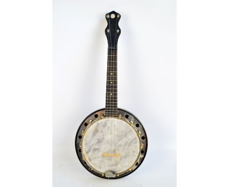 RUSHWORTH & DRAPER; a cased four string ukulele 'Monarch MO.1', length 60cm.    CONDITION REPORT:  The brand is marked on the