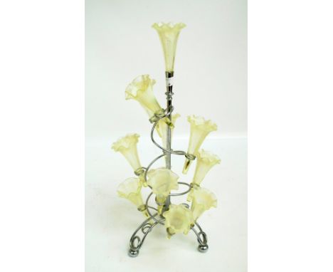A vaseline glass epergne with chromed scrolling frame on tripod base, height 47.5cm.   CONDITION REPORT:  Chips to two of the