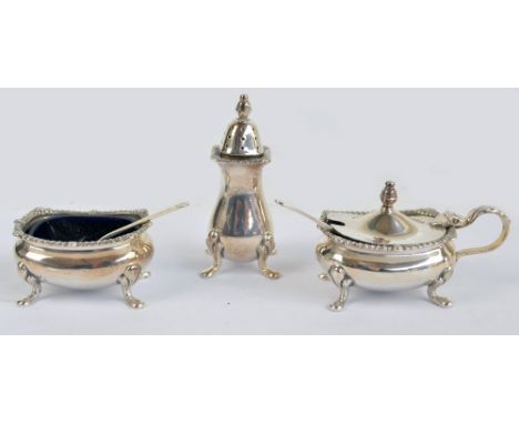 ROBERTS & BELK; an Elizabeth II hallmarked silver three piece cruet set comprising baluster pepper on four legs, open salt an