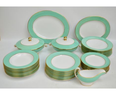A Copeland Spode dinner service with gilt edged mint green border, numbered Y3712, comprising two oval platters of different 