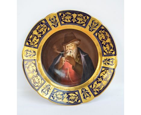 A late 19th century Vienna porcelain cabinet plate centred with a circular panel of a bearded gentleman lighting a pipe withi