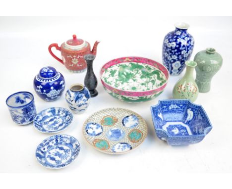 A group of various Chinese porcelain items including a circular bowl painted in enamels with two chasing dragons amongst clou