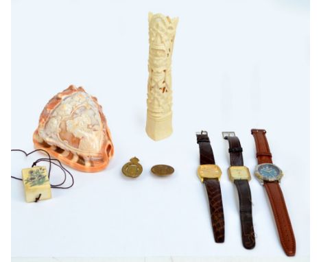 A small mixed lot of collectors' items comprising a carved shell, an Indian bone carving of a deity, a bone inro with frog fi