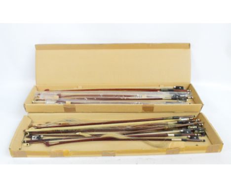 Two boxes of assorted violin and viola bows (approx 20).