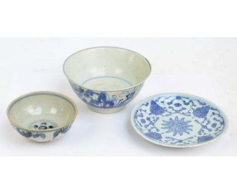 Two 19th century Chinese porcelain bowls, both painted in underglaze blue with floral motifs, the larger diameter 16.5cm, mar