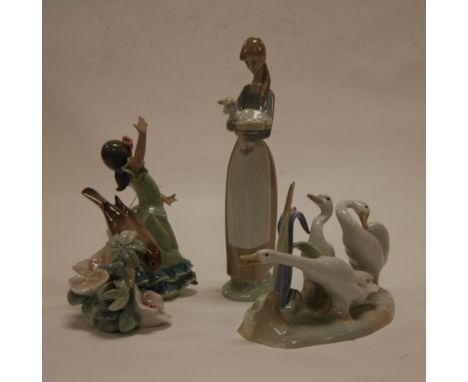 A collection of four various Lladro figures to include; girl with lamb, dancer, geese, and bird (dancer a/f) 