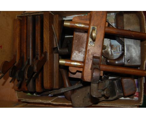A box of various woodworking planes, and other woodwork tools