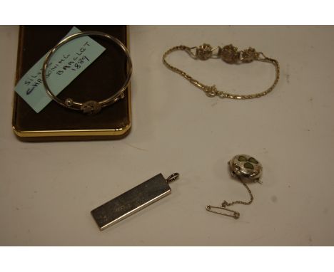 A late Victorian silver christening bangle, silver pendant, bracelet and pin brooch (4)