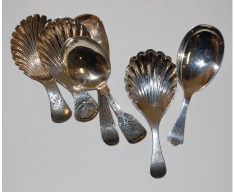 A collection of circa 1830 and later silver caddy spoons to include three examples with shell embossed bowls, and four with b