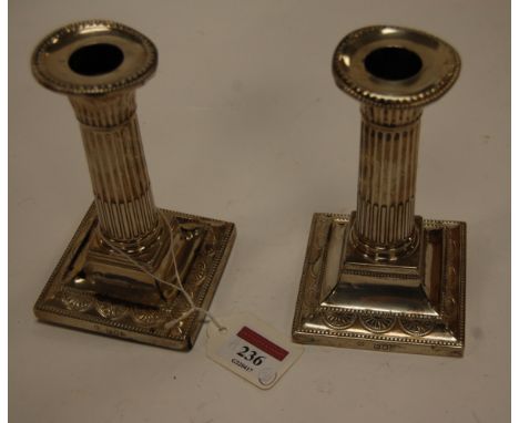 A pair of late Victorian silver column dwarf table candlesticks by William Hutton & Sons Ltd, London, 1898   Condition Report