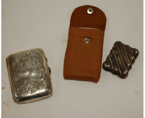 An engine turned silver pocket cigarette case, silver and engraved pocket cigarette case, and a silver vesta case, 5oz (3)