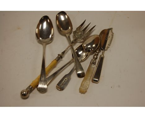 A mid 18th century silver table spoon having a rat tail bowl, monogrammed terminal, a later Georgian silver table spoon, toas