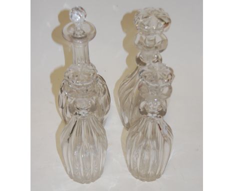 A set of three 19th century fluted glass decanters each with mushroom shaped stopper together with one other glass decanter a