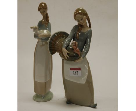 A Lladro figure modelled as a girl holding a turkey, printed mark verso, h.26cm; together with another Lladro figure of a gir