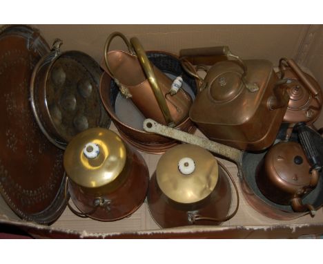 A box of miscellaneous metalwares to include; large circular embossed copper tray, helmet shaped coal scuttle, range kettles 