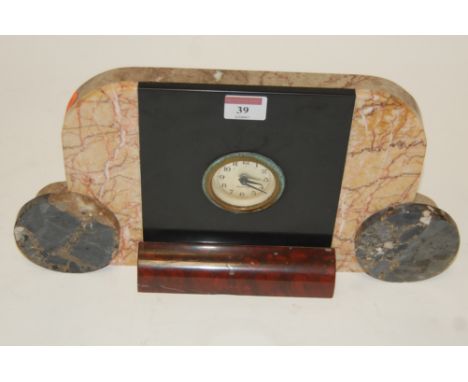 An Art Deco veined marble cased mantel clock having silvered engine turned dial with Arabic numerals, signed Mercedes, width 