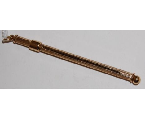 An engine turned 9ct gold swizzle stick, 5.6g