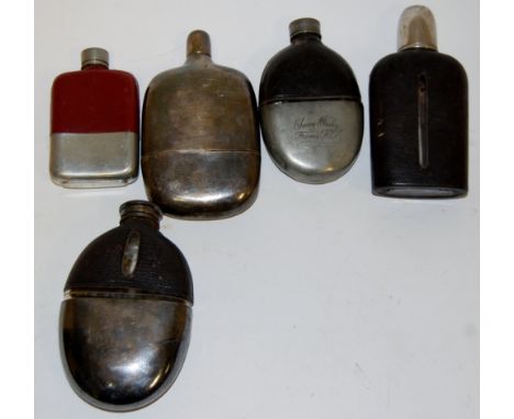 A Victorian pewter and leather clad hip flask; together with four other Victorian and later hip flasks (5)