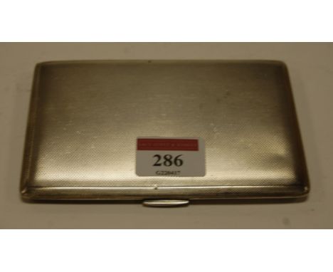 An engine turned silver pocket cigarette case having gilt washed interior, 6.4oz, 13cm