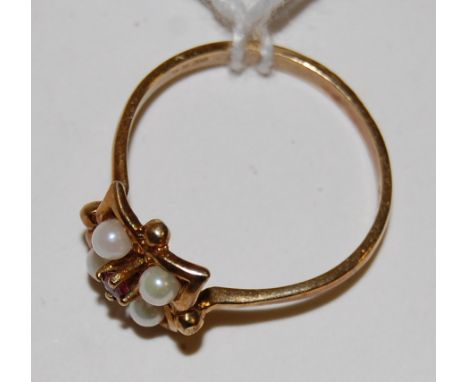 A ladies 9ct gold ruby and seed pearl set ring size N-