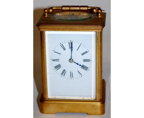 A circa 1900 French lacquered brass carriage clock having white enamel dial, visible platform escapement and twin barrel goin