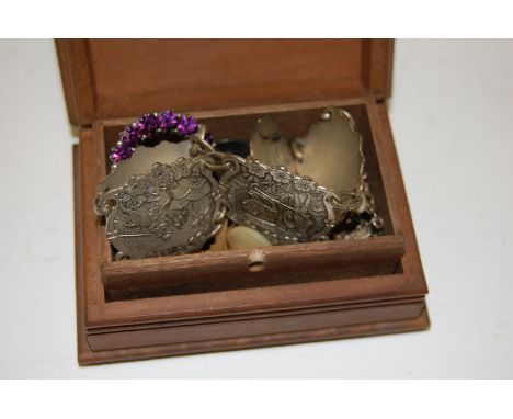 A carved softwood trinket box and contents to include silver button, yellow metal cufflinks, costume jewellery etc 