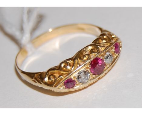 A ladies 18ct gold ruby and diamond set ring, size P