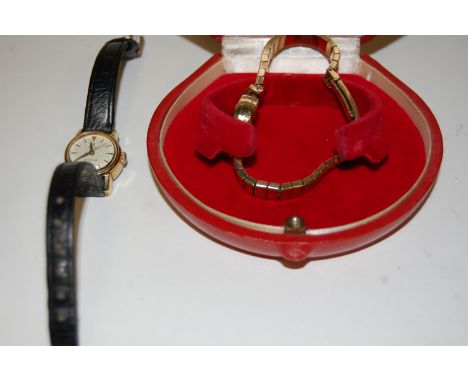 An Omega 9ct gold cased ladies dress watch having signed gilded dial, baton markers, manual wind movement and on a 9ct gold b
